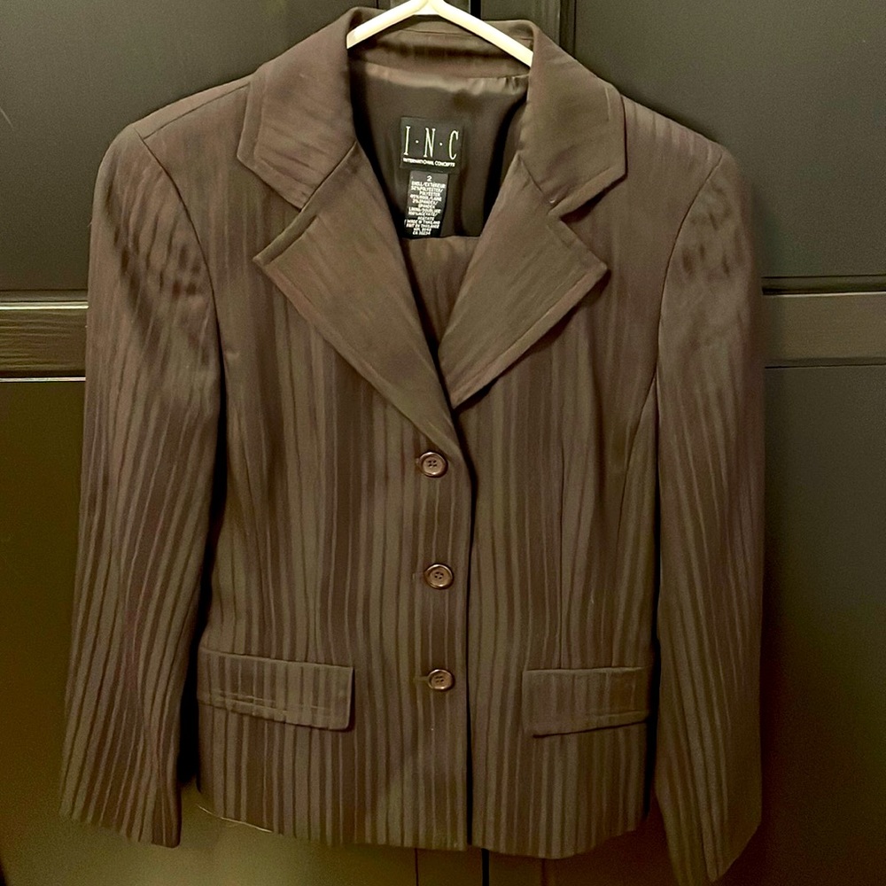 INC womens chocolate brown suit. Fully lined. Size 2 jacket and size 4 pants.